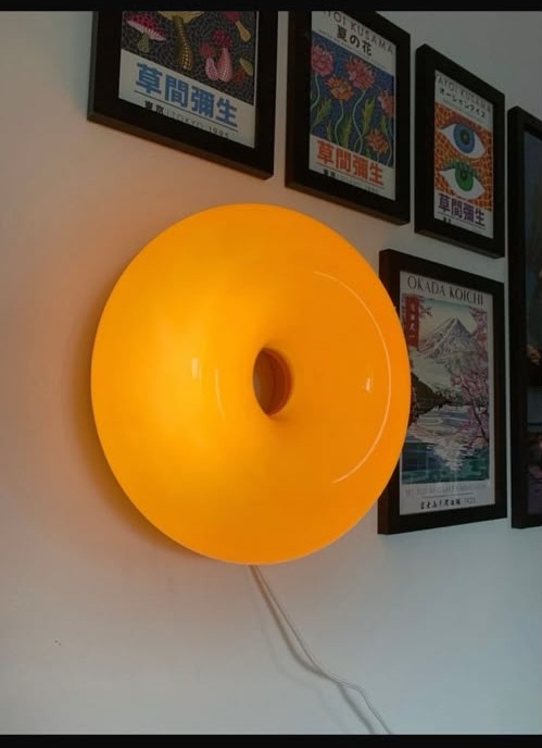 Donut Lamp glowing on a wall